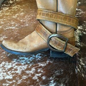 Vintage leather stamped belt with metal buckle.